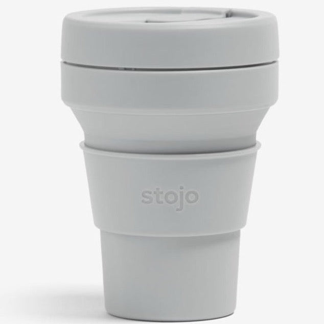 Grey collapsible cup on white backgorund.