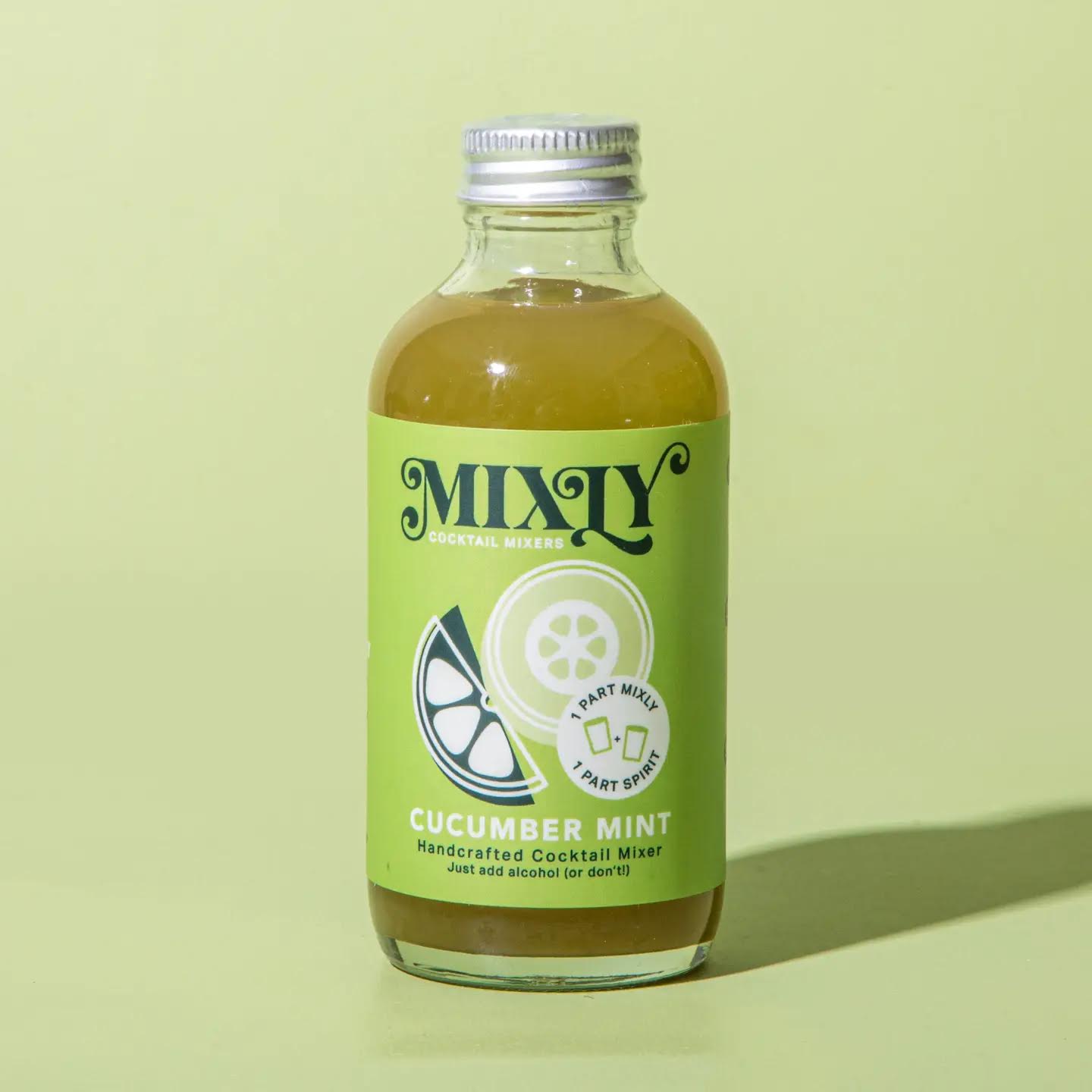 Bottle of Mixy Cucumber Mint cocktail mixer on a light green background
