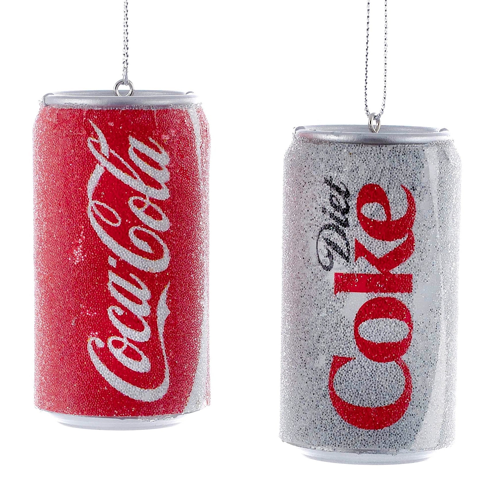 Decorative Christmas ornaments shaped like Coca-Cola and Diet Coke cans on a white background