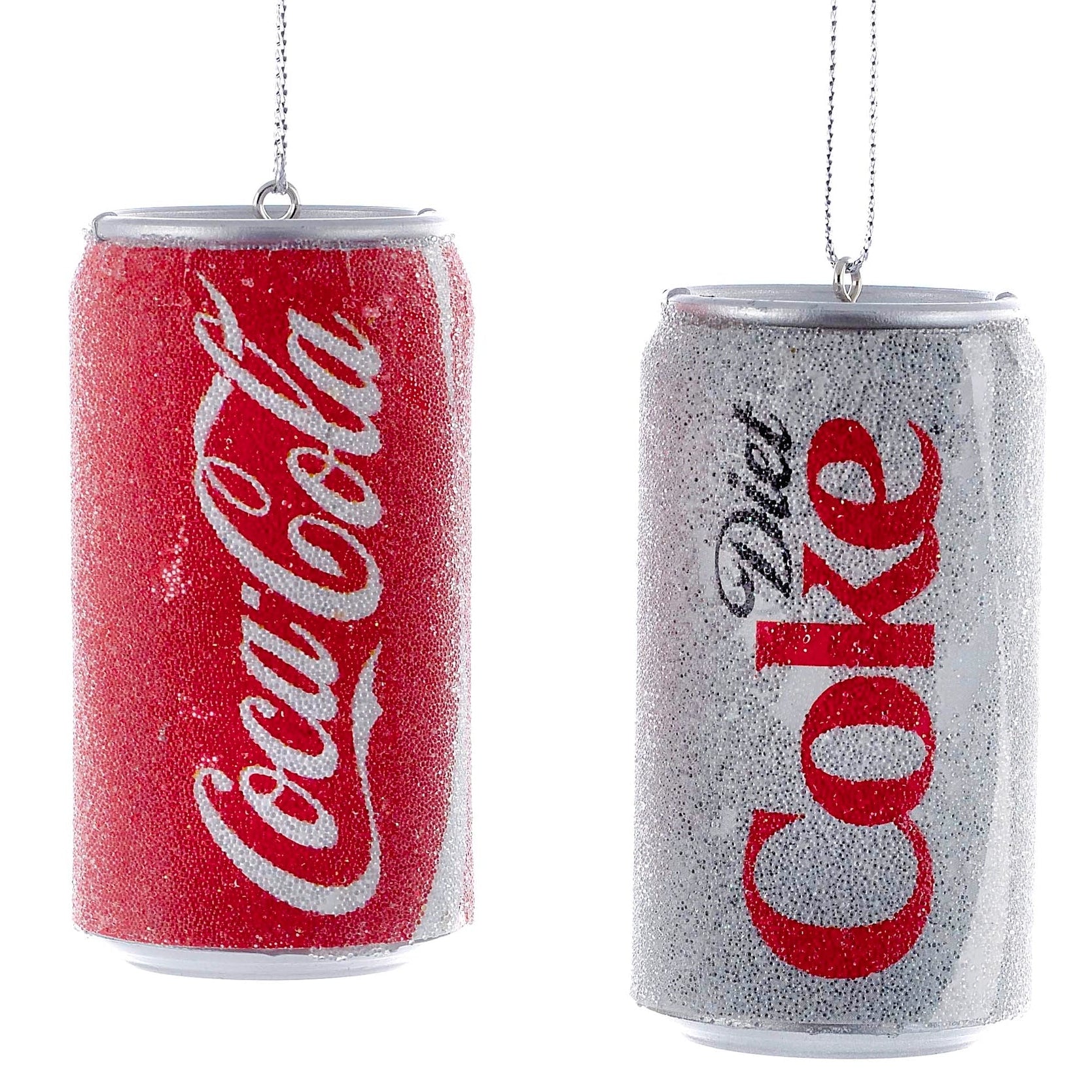 Decorative Christmas ornaments shaped like Coca-Cola and Diet Coke cans on a white background