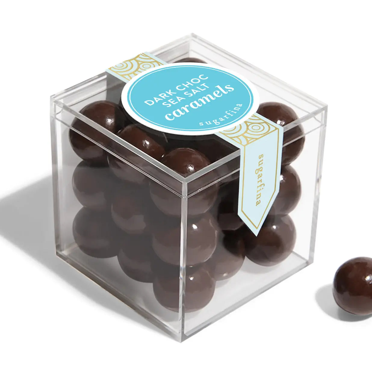 Box of dark chocolate sea salt caramels with a label on a white background