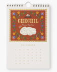 December page of the 2025 Cheese Calendar highlighting Chechil, an Armenian string cheese. The design has a rustic red background with floral borders and an illustration of the cheese.