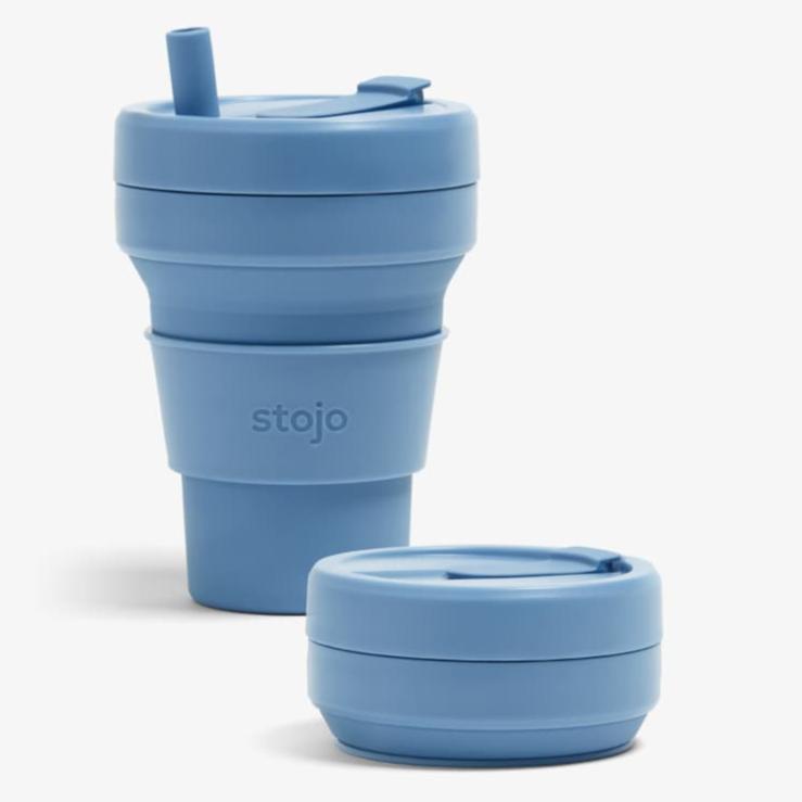 blue cup with straw next to collapsed clue cup