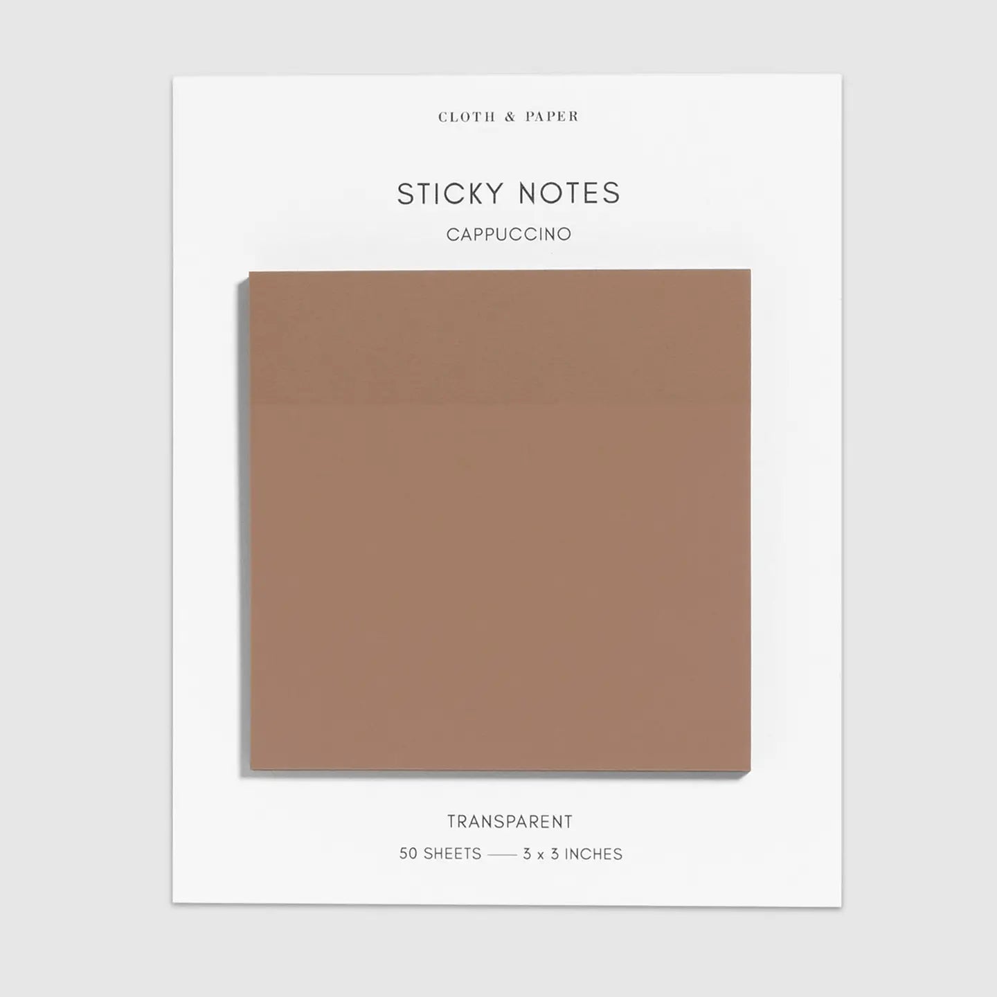 A pack of sticky notes on a white backing card, labeled 'STICKY NOTES CAPPUCCINO' and 'TRANSPARENT 50 SHEETS — 3 x 3 INCHES.' The notes themselves are a muted warm taupe-brown and are shown centered on a light gray background.