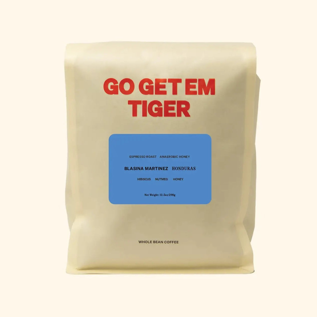 Coffee bag with 'GO GET EM TIGER' text on a beige background