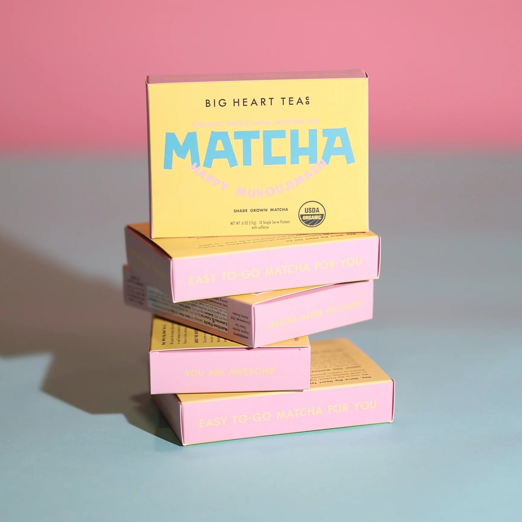 Happy Matcha box stack on pink and blue background