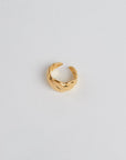 Gold Croissant Ring on white background.