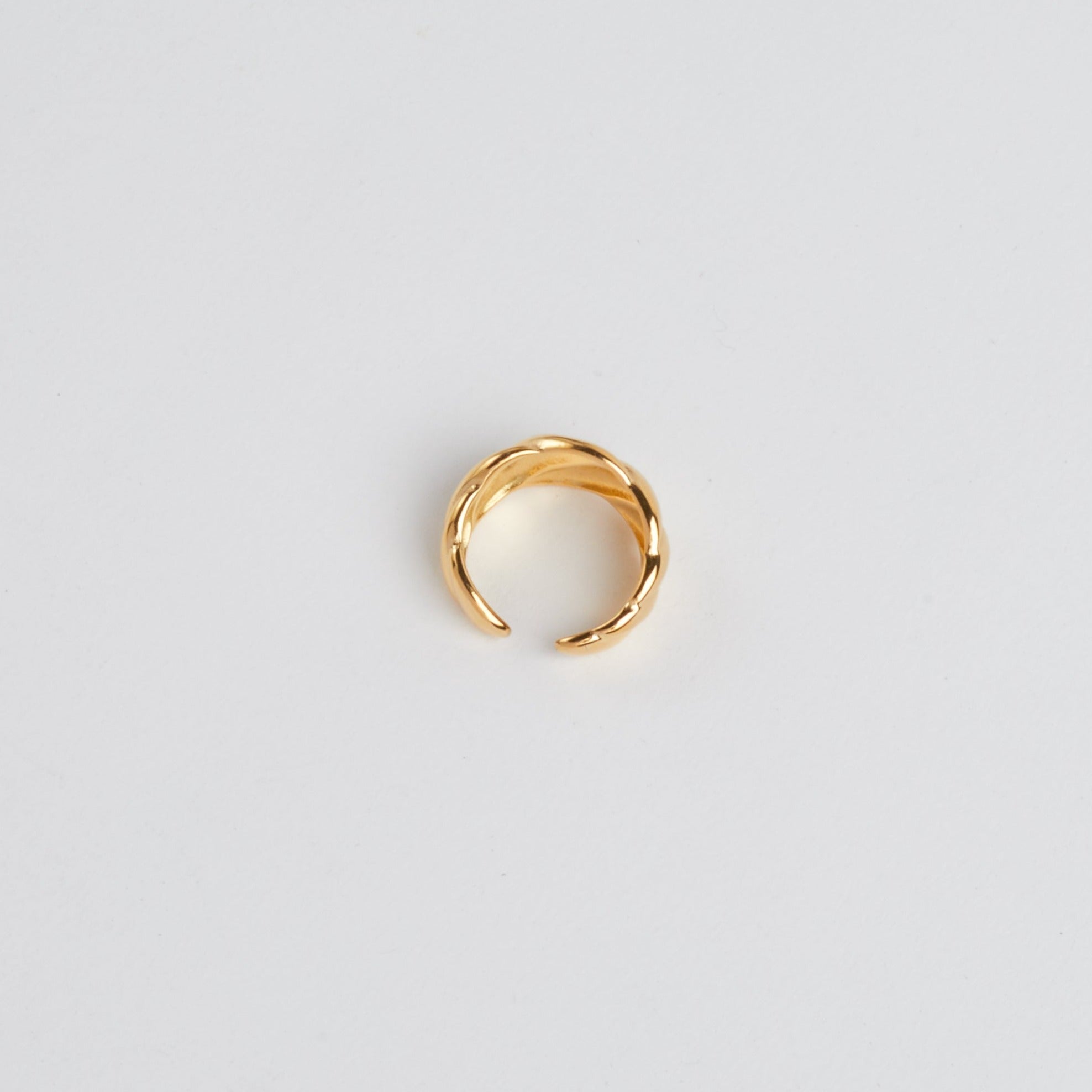 Gold Croissant Ring on white background.