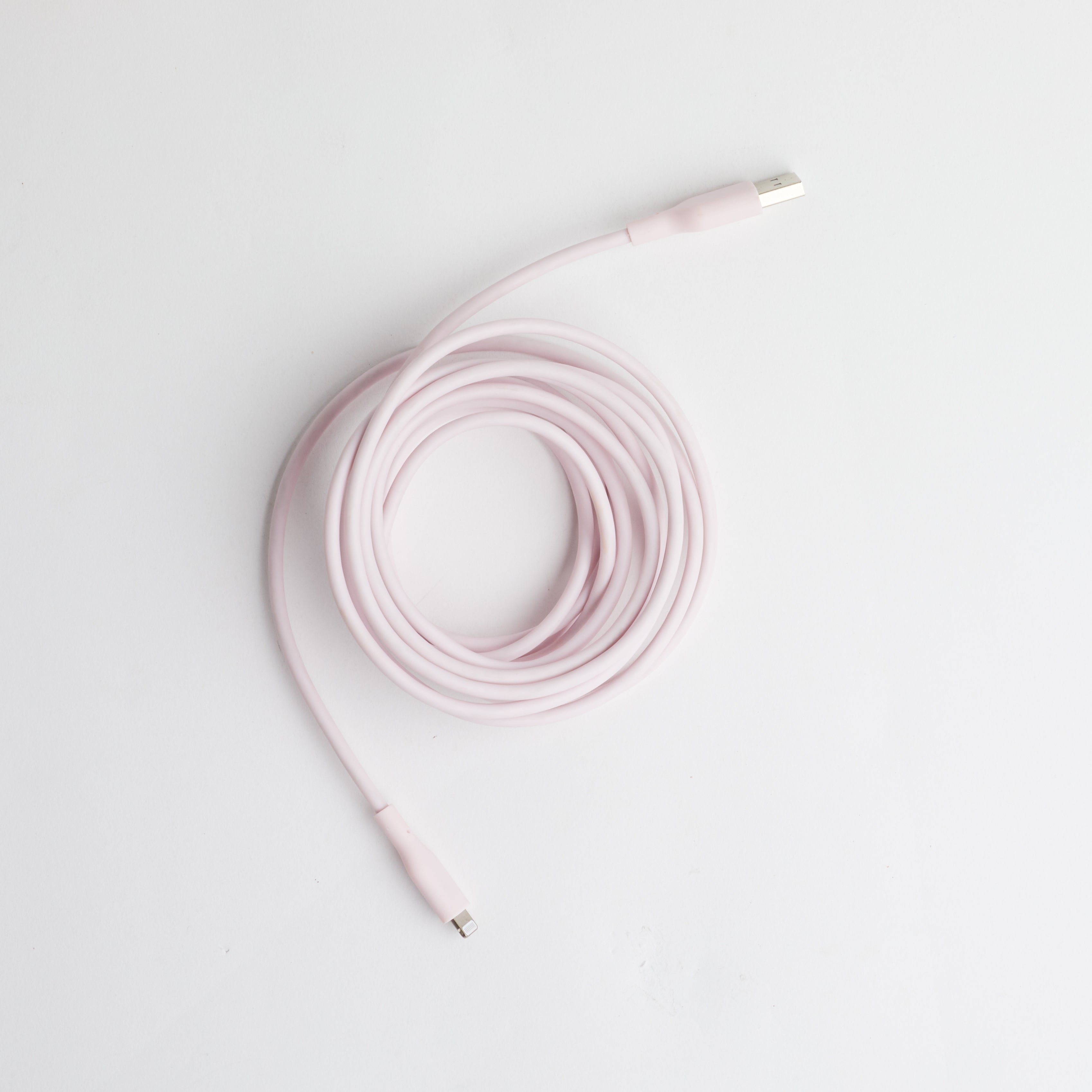 Coil of pink phone charging cable