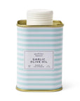 McEvoy Ranch Garlic Olive Oil in a square metal tin with a white screw cap, featuring a light blue and white striped pattern with a white label and gold-toned metal rims.