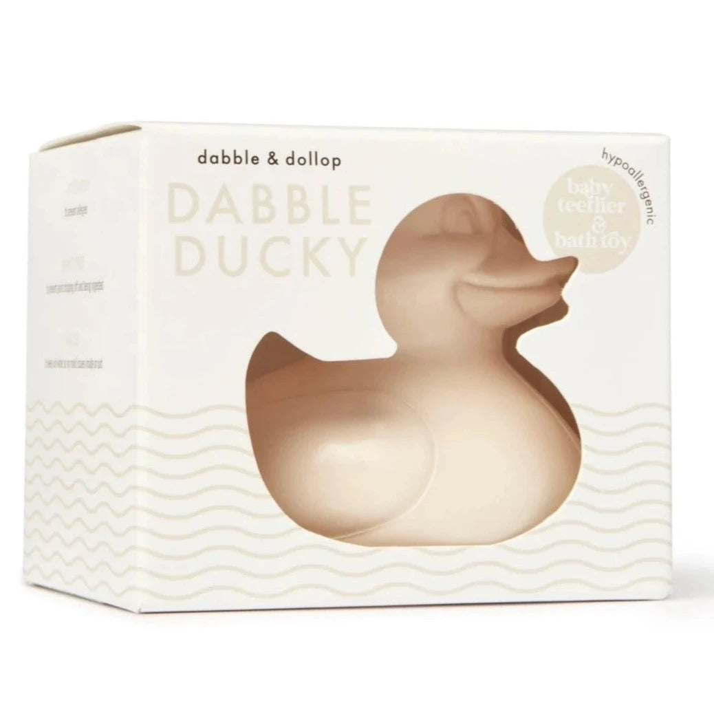 creme colored duck in white box with creme waves illustrated on the bottom half of it