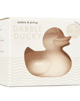 creme colored duck in white box with creme waves illustrated on the bottom half of it