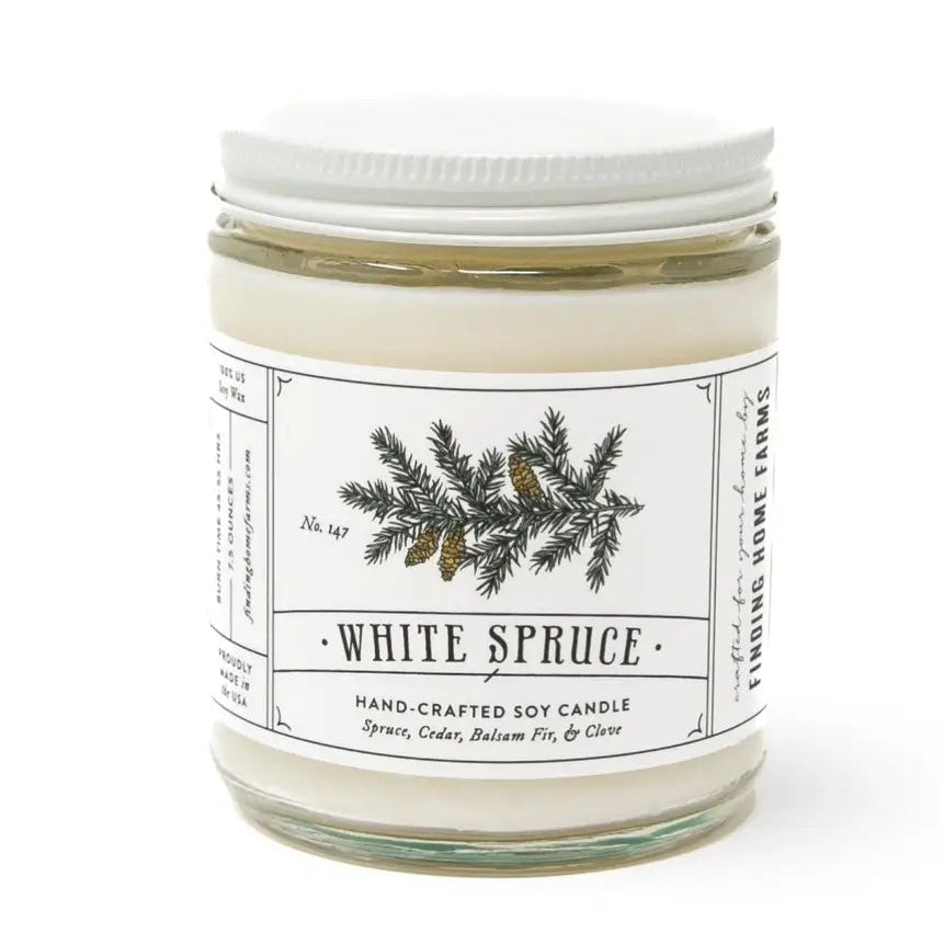 White spruce candle with a label on a white background