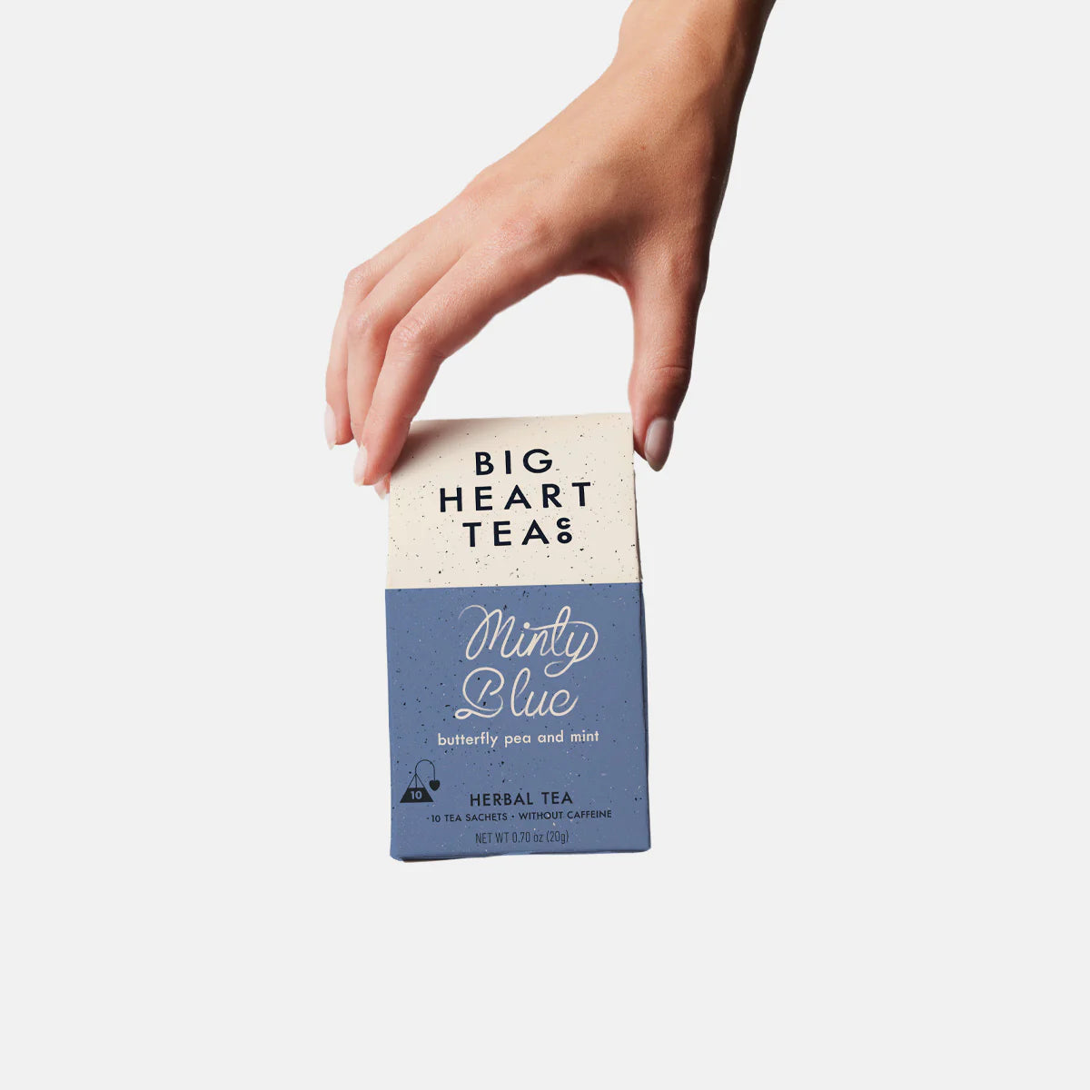 Hand holds Minty Blue Tea.