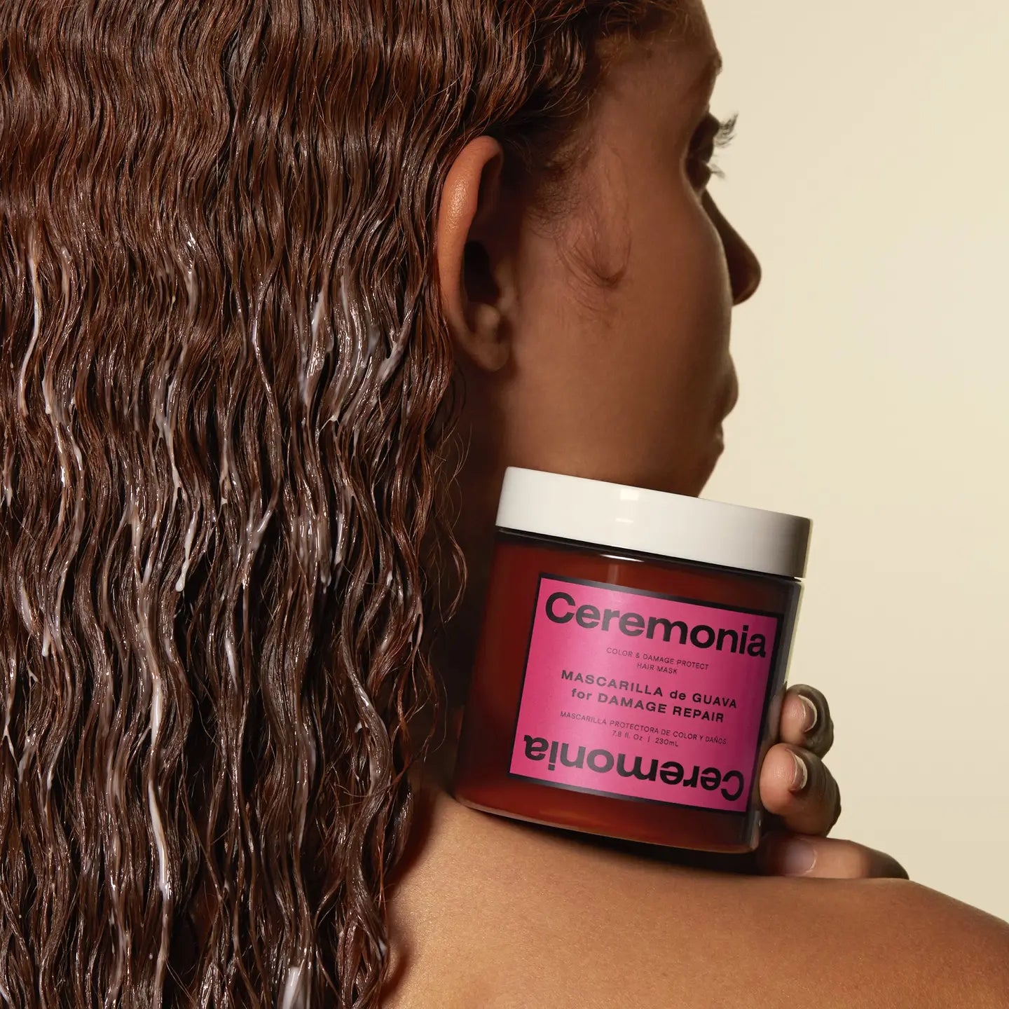 woman holding the ceremonia hair mask