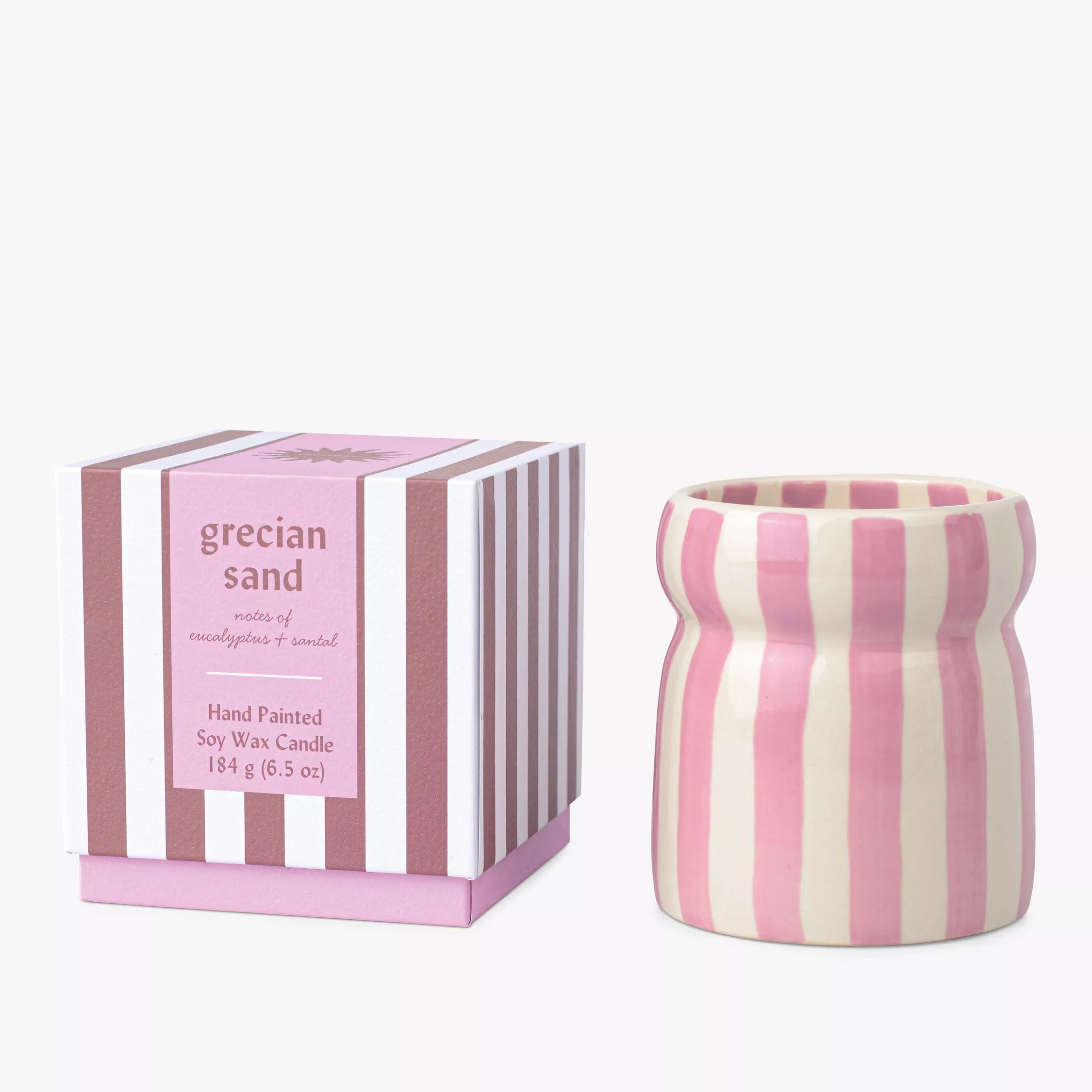 Pink and white striped candle with matching packaging on a white background
