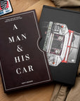 A man and his car book on a brown table