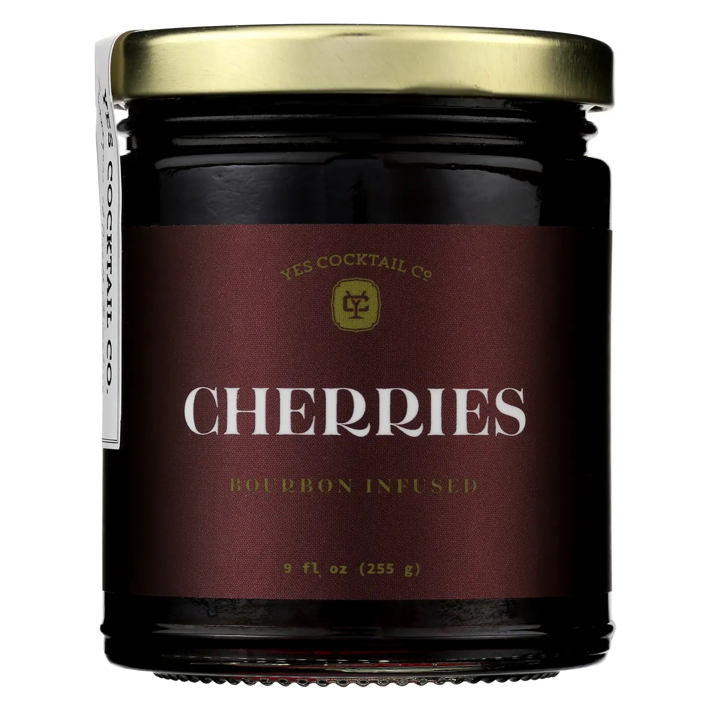 Jar of bourbon infused cherries with a maroon label on a white background