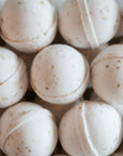 Close-up of beige bath bombs with a white background