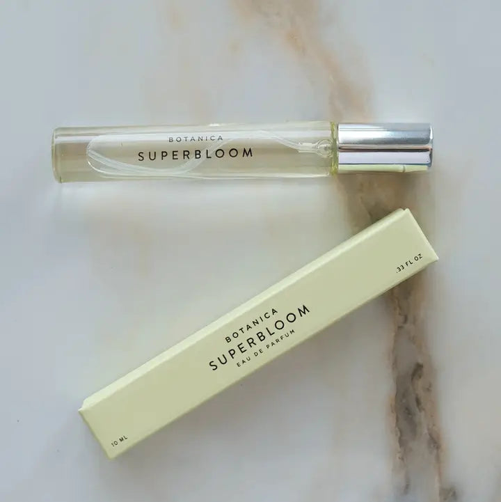 superbloom perfume on a marble background
