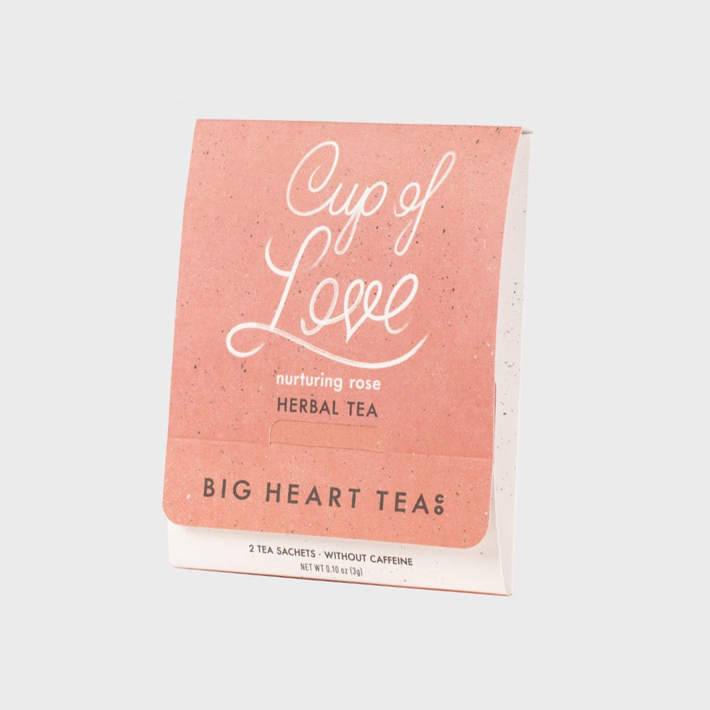 pastel pink tea sachet packaging with white text and brown text at the bottom 