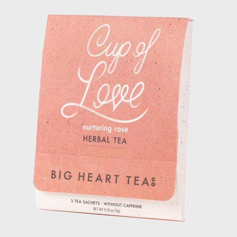 pastel pink tea sachet packaging with white text and brown text at the bottom 