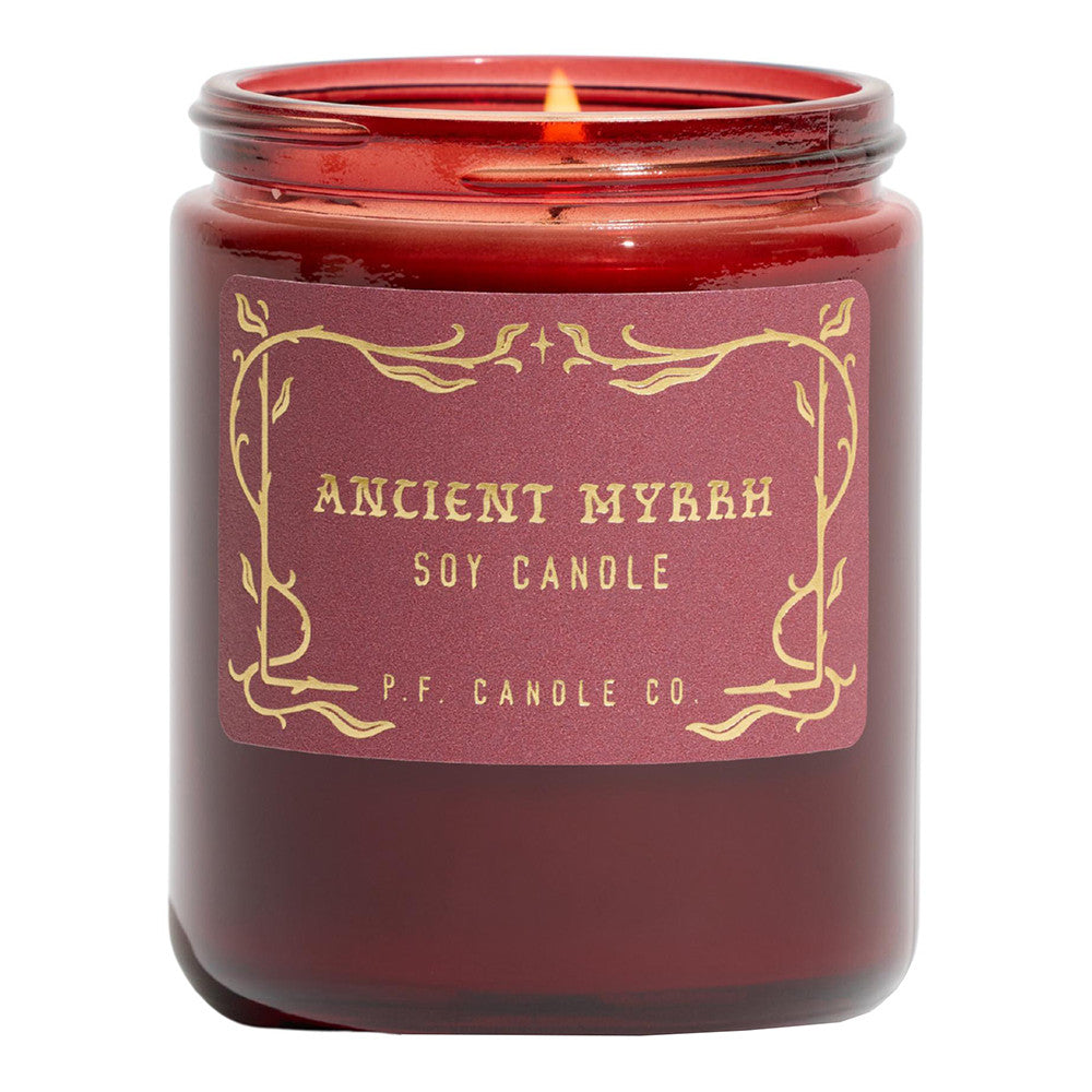 Red candle with a label reading 'Ancient Myrrh Soy Candle' from P.F. Candle Co.