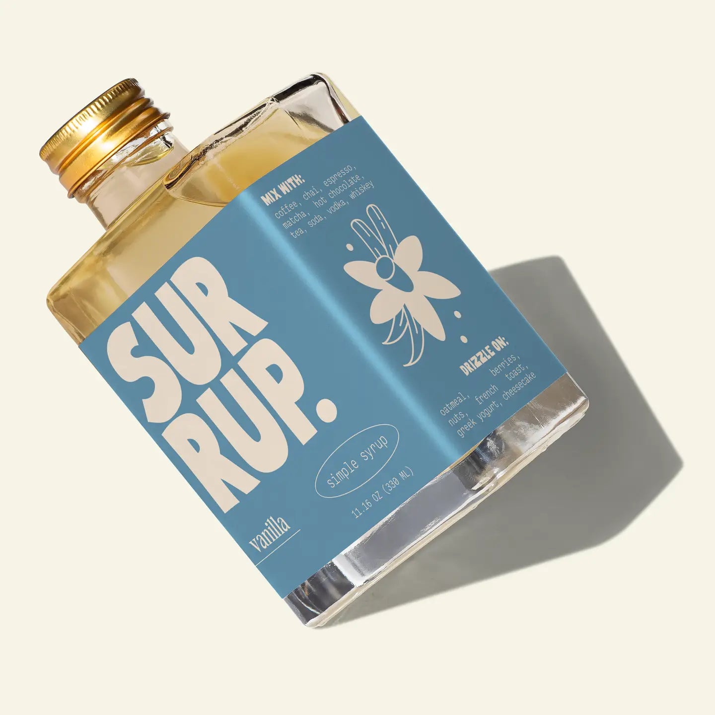 Vanilla syrup bottle with blue label on a light background