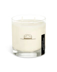 white candle with black illustration on it. on the right hand side is black sticker label