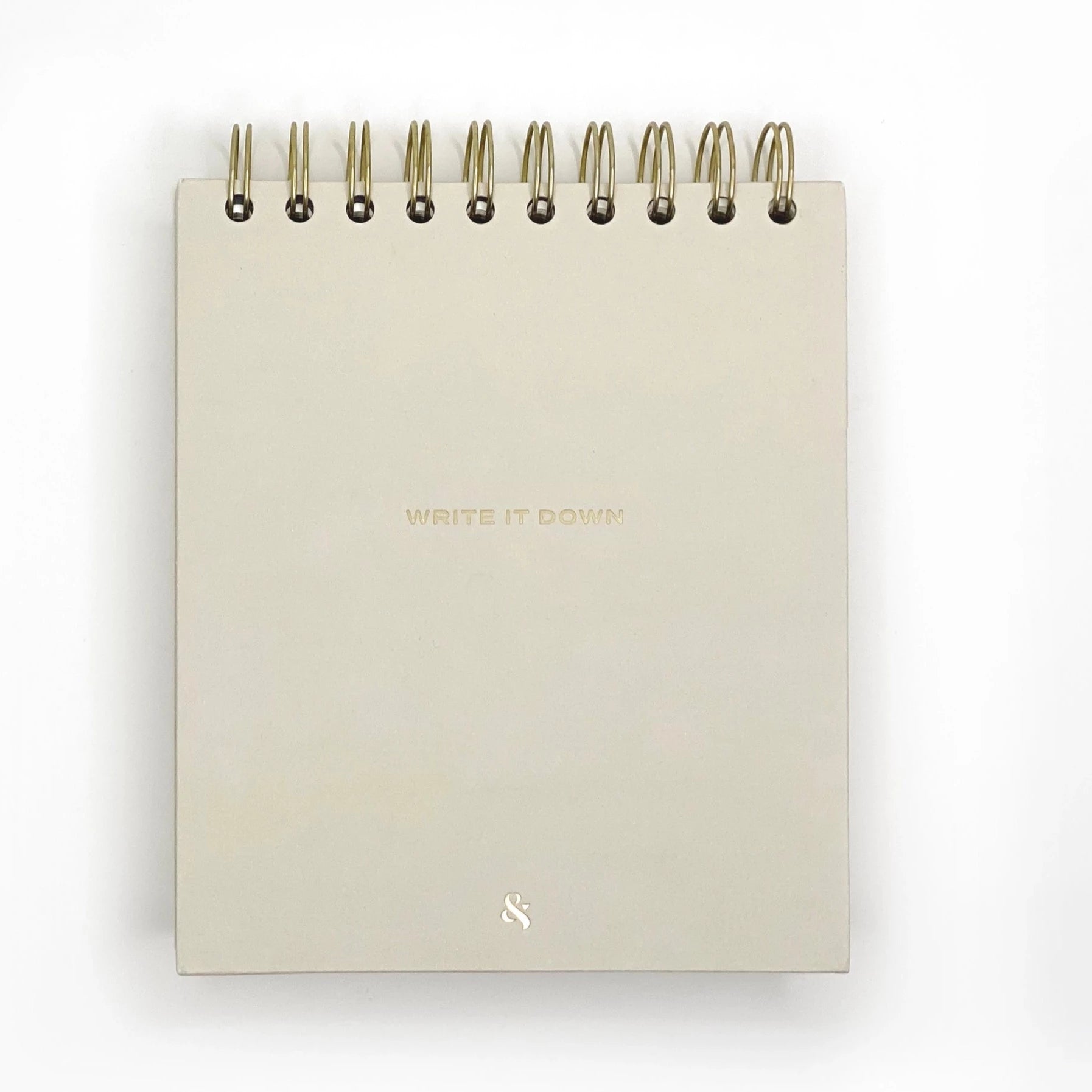 creme mini notepad with gold spiral bound at the top. on the cover it says"write it down"