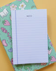 blue lined notepad that ays "NOTES" at the top on yellow background