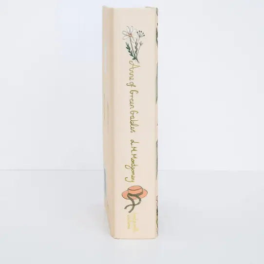 Book with decorative cover featuring floral illustrations on a white background