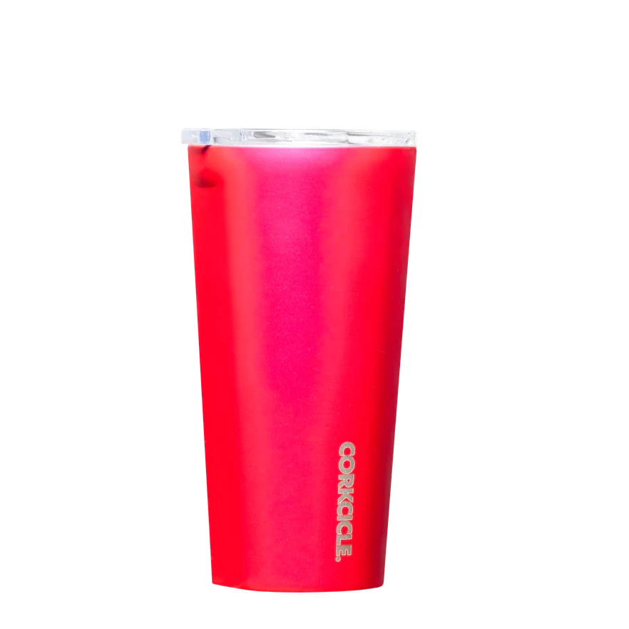 Metallic hot pink tumbler with silver text at the bottom going vertically. Lid is clear