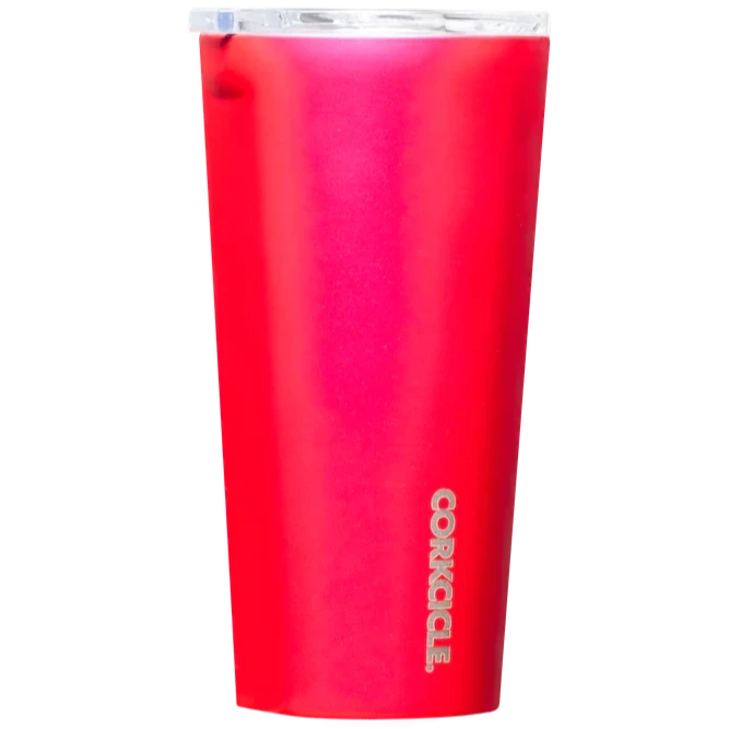 Metallic hot pink tumbler with silver text at the bottom going vertically. Lid is clear