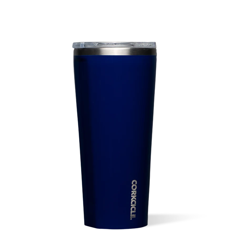 gloss navy blue tumbler with silver text and lining at the top. lid is clear