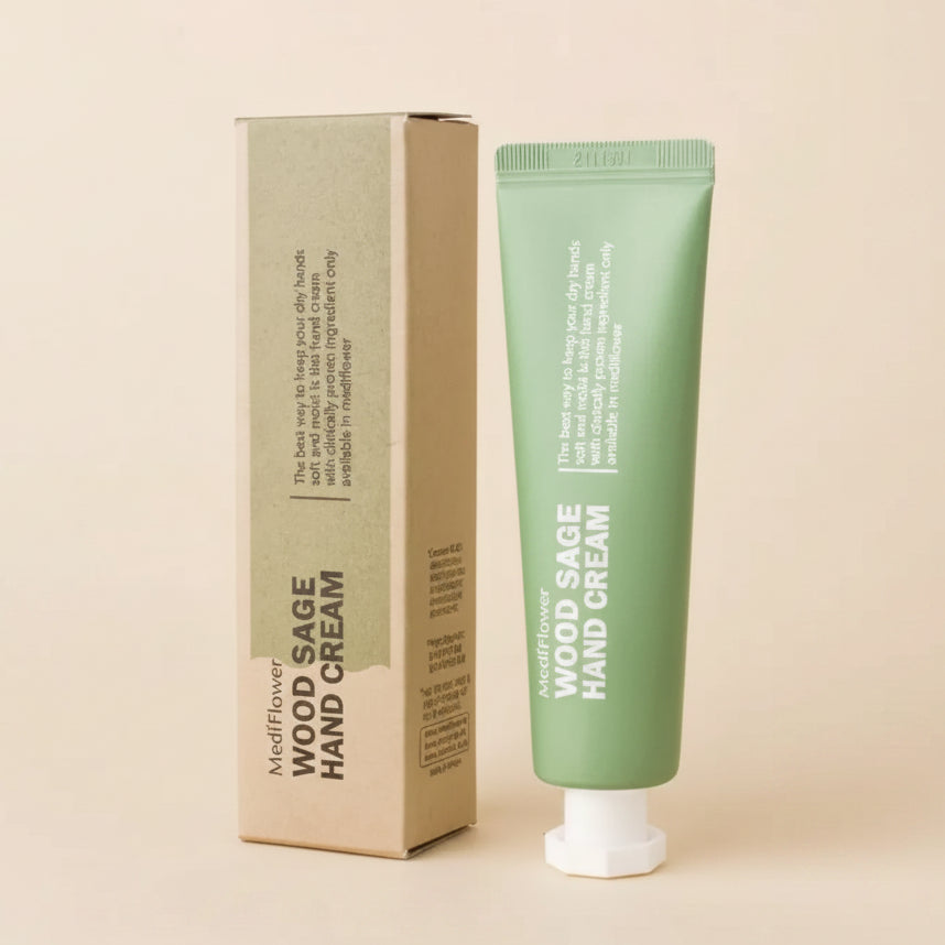 Wood Sage Hand Cream packaging with tube and box on a beige background