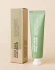 Wood Sage Hand Cream packaging with tube and box on a beige background