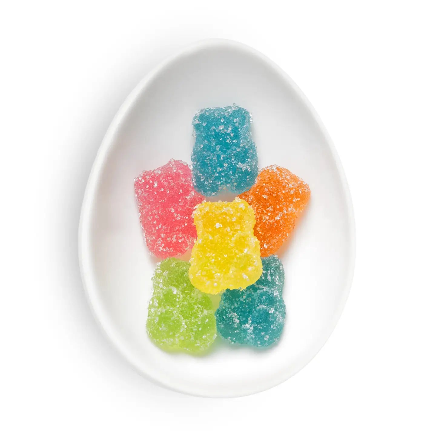 Colorful gummy bear candies on a white plate