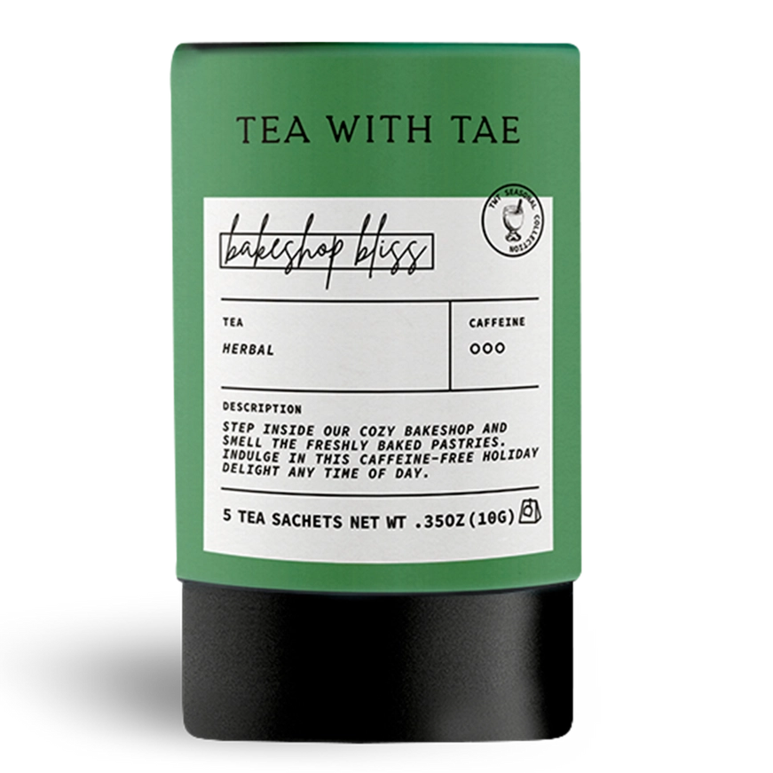 Tea packaging with a label and decorative holly leaves on a white background