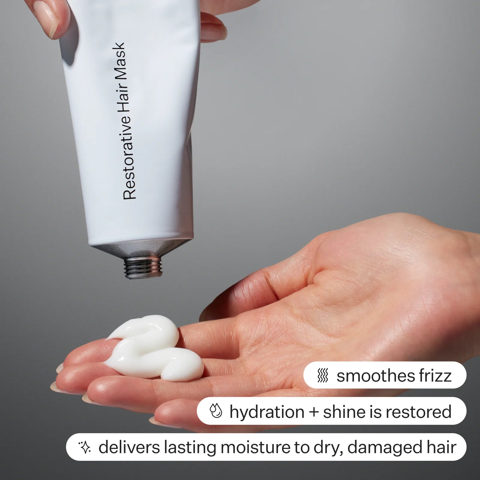 Restorative Hair Mask squeezing out into hand