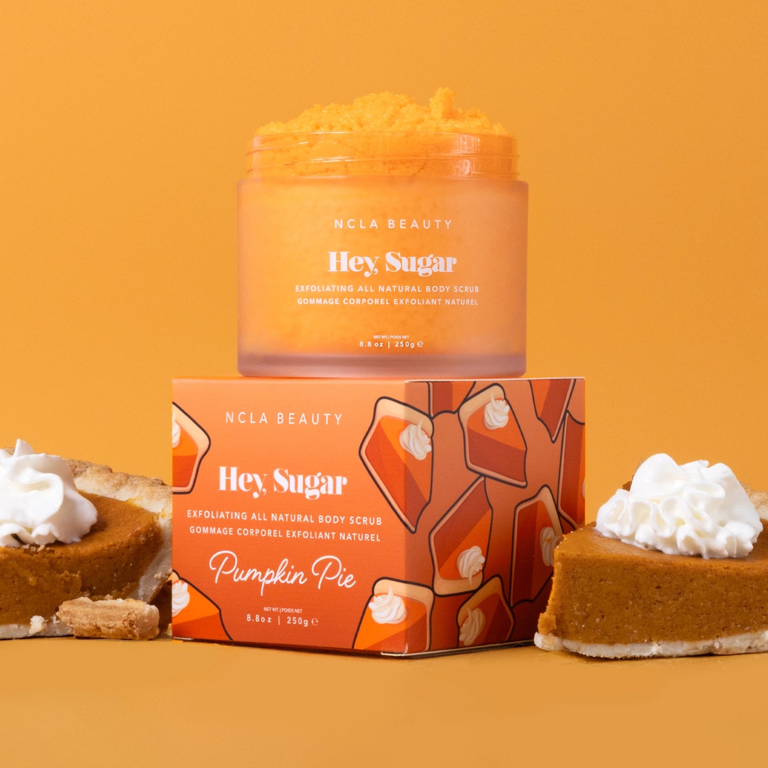 NCLA Beauty 'Hey Sugar' pumpkin pie-themed product on an orange background with a pie slice.