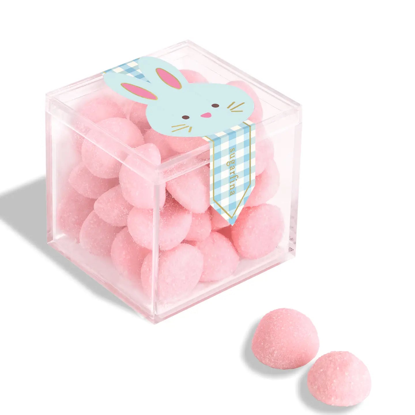 Clear cube box with pink heart-shaped candies and a bunny-themed label on a white background