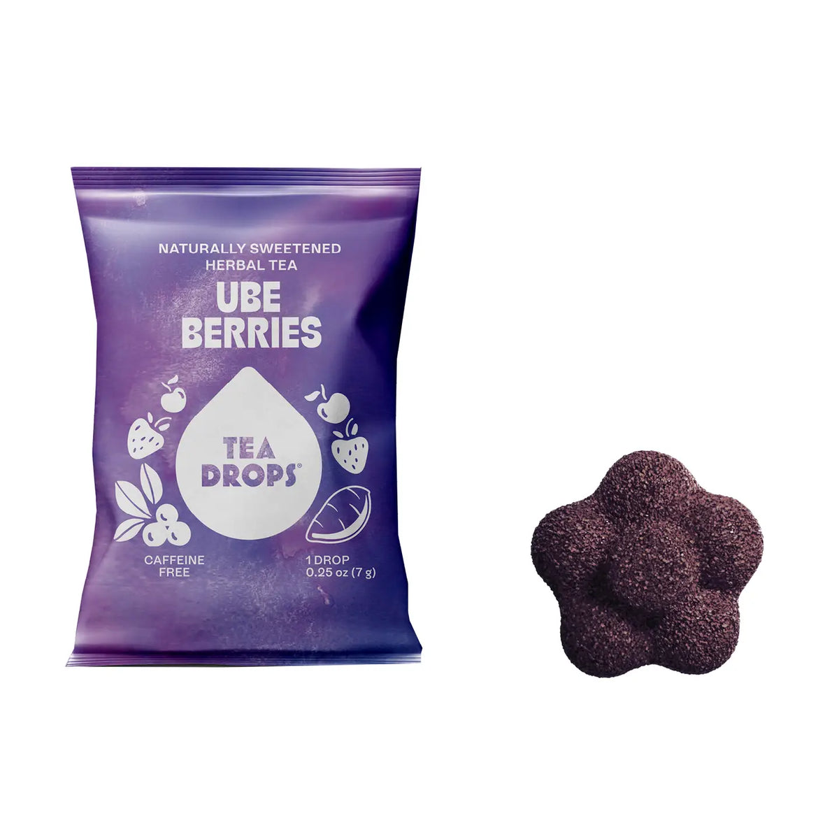 A purple bag of Tea Drops Ube Berries herbal tea drops next to a single flower-shaped dark purple tea drop on a white background.