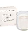 ribbed glass candle next to box that says 'FUTURE MRS.'