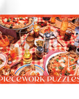 red puzzle with picture of pizzas on a red & white checkered tablecloth