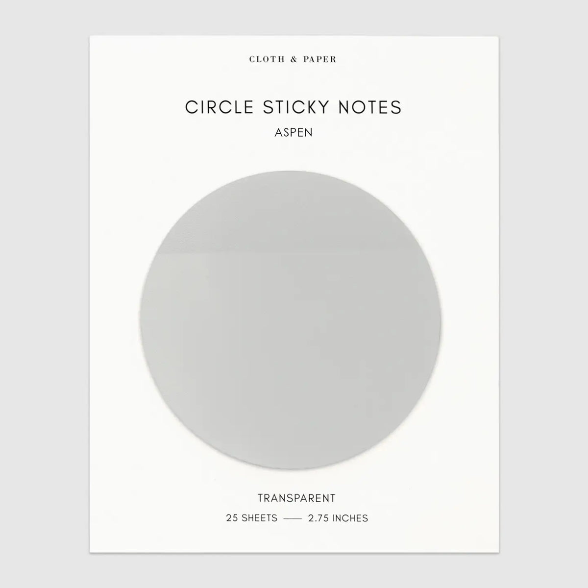 A pack of transparent circle sticky notes in the scent Aspen, presented on a white backing card with black text. The backing card features a large, semi-transparent gray circle representing the note's shape and transparency.