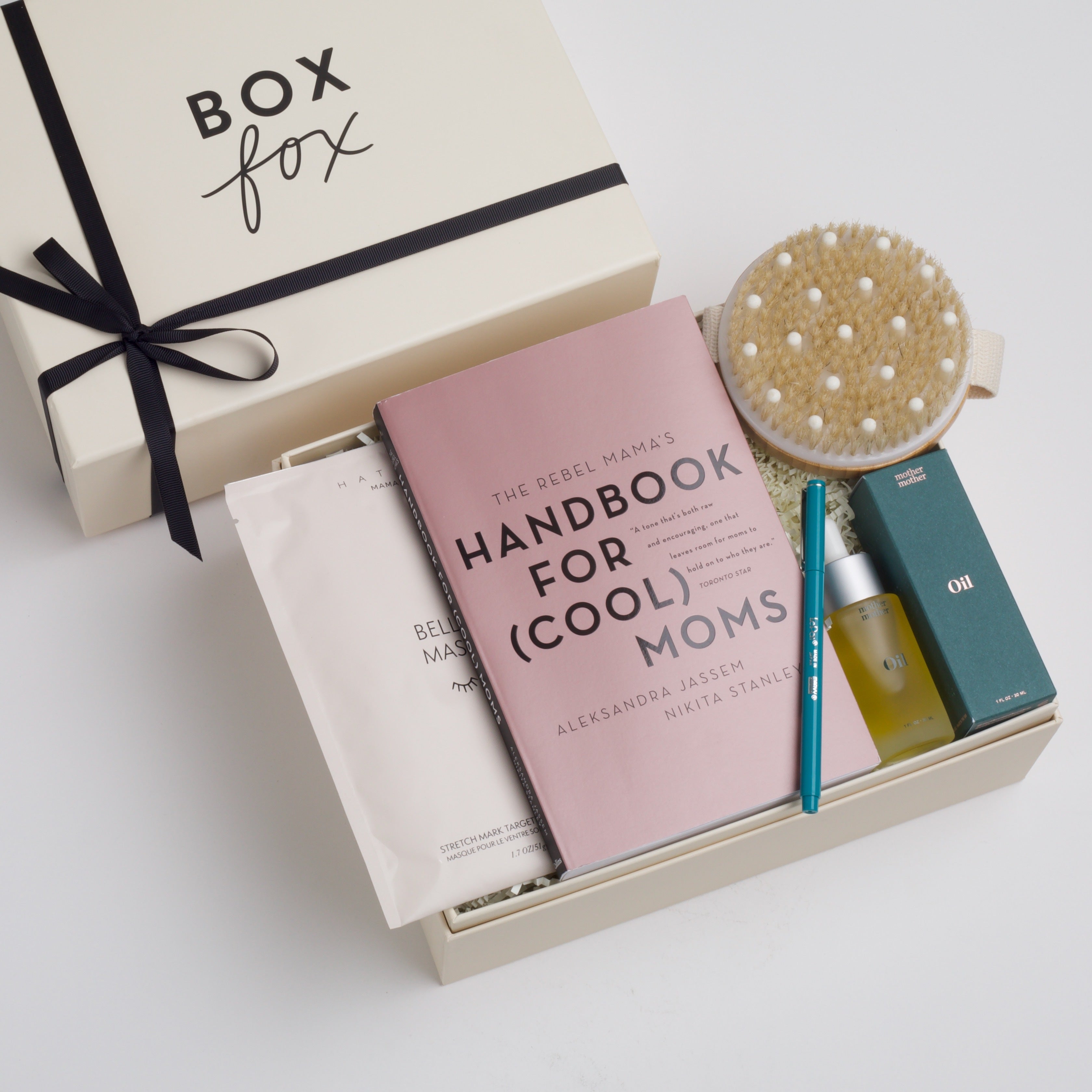 BOXFOX Gift Box filled with Handbook for (Cool) Moms, Le Pen Teal Pen, Mother Mother Belly Oil, HATCH Belly Sheet Mask, and Skön Round Dry Brush