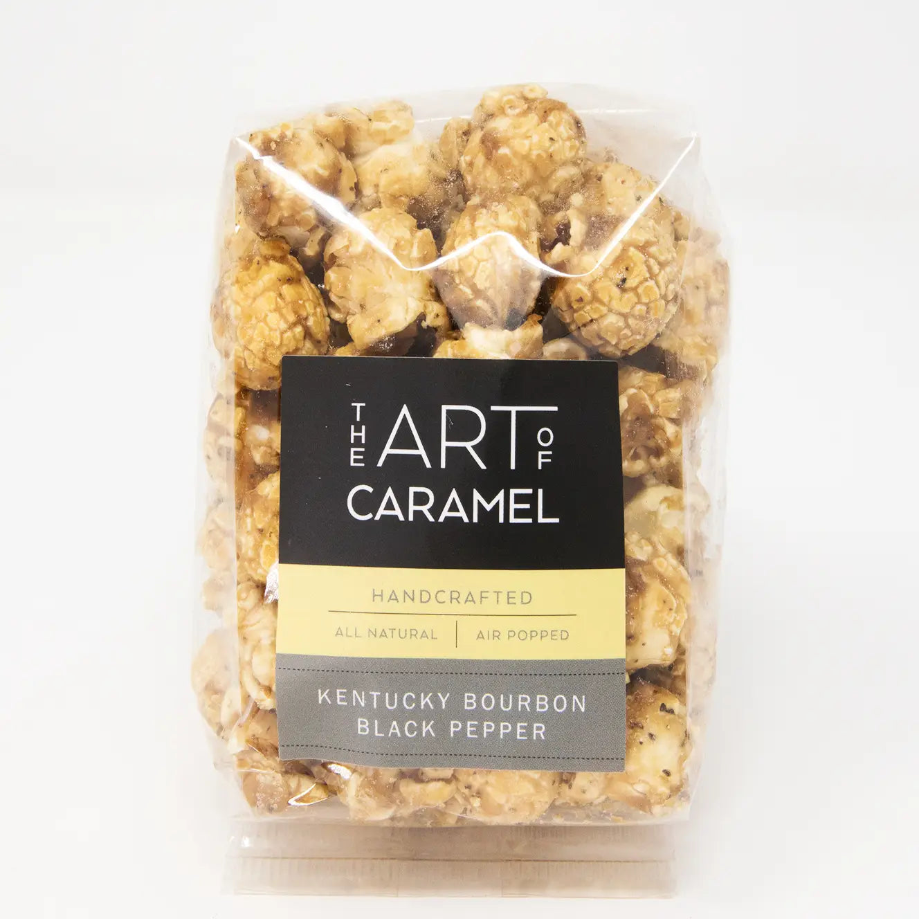 Packaged caramel popcorn with 'The Art of Caramel' label on a white background