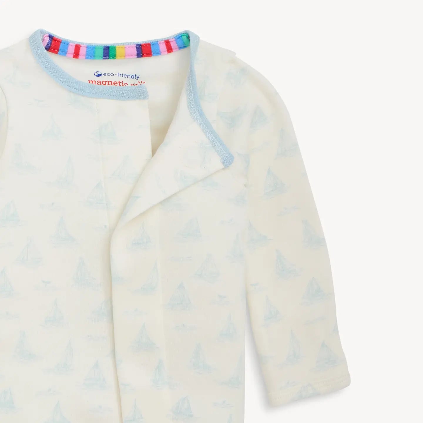 Baby cardigan with colorful trim on a white background