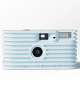 Light blue instant camera on a white background